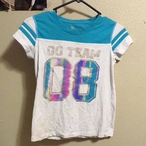 Team shirt; number 08 and says “Go Team!”